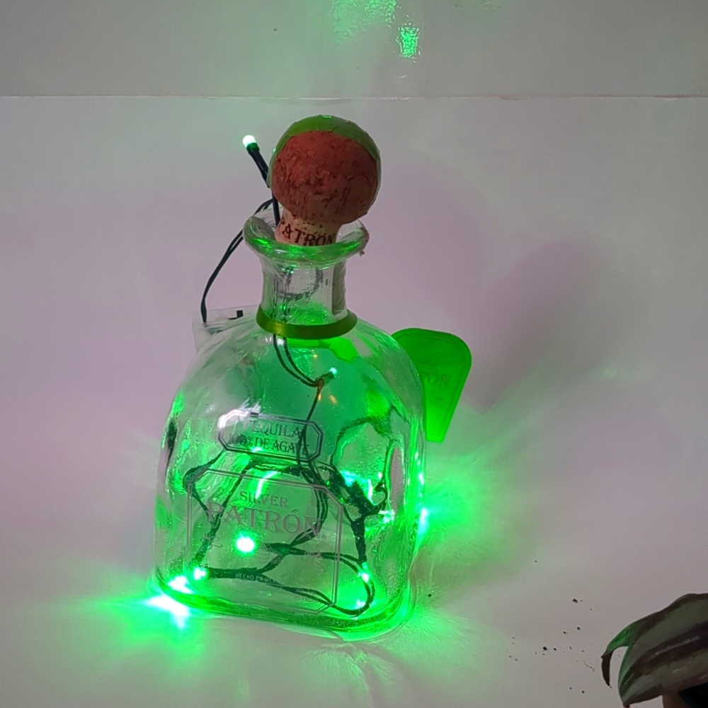 A patron tequila bottle lights.